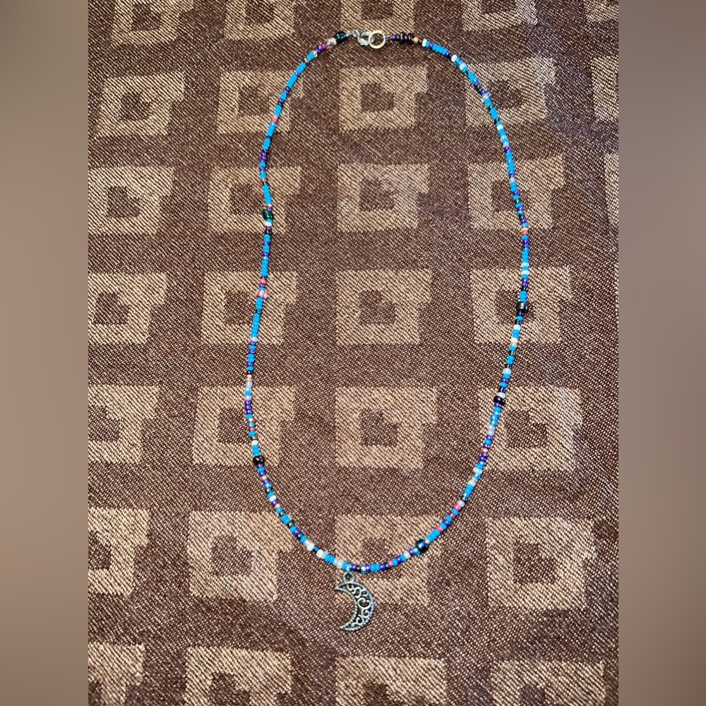 Handmade blue bead necklace with moon charm
